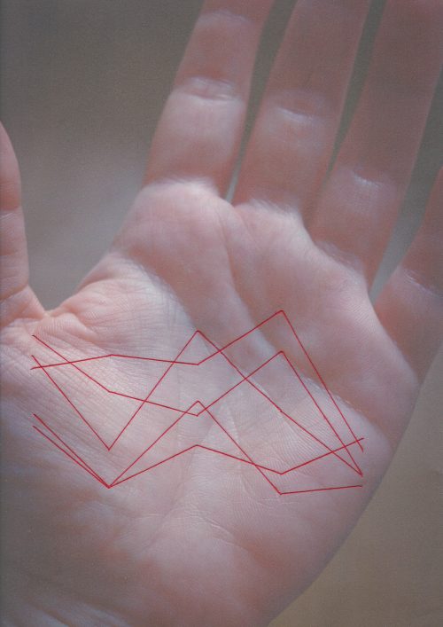 This embroidered data visualization maps five cities where I have lived across five geographic dimensions using the parallel coordinates technique. Each city is represented by a continuous thread connecting data points across vertical axes. The vertical axes (left to right): latitude, longitude, population, distance from Lisbon, elevation. The cities (top to bottom): Tallinn, Estonia; London, UK; Dnipro, Ukraine; Porto, Portugal; Lisbon, Portugal. The embroidery overlays the palm of my hand, the stitched lines resembling lifelines.